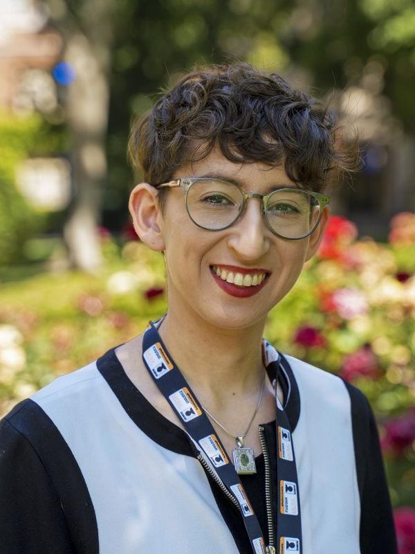 Headshot of Gillian Goldberg in front of rose garden