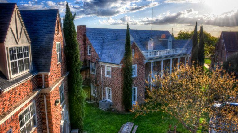 sunflare over fraternity buildings