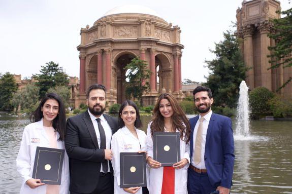 group standing in front of the Palace of Fine Arts