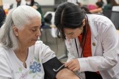  PharmD student with patient at clinic