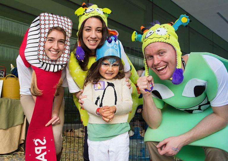 SCOPE volunteers with child