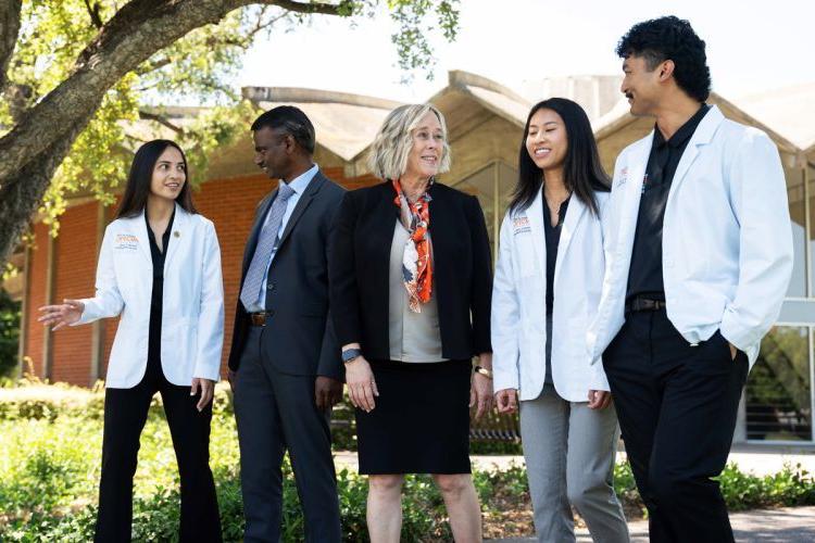 Dean Berit Gundersen and Dr. Srikanth Kolluru with students