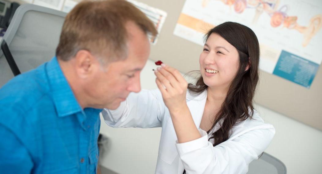 Audiology student with patient