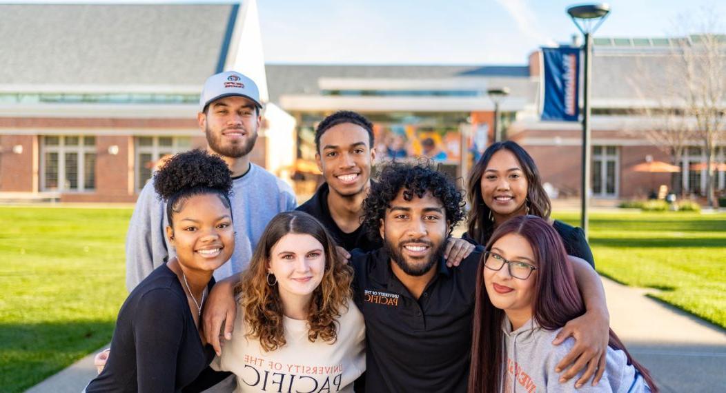 A group of students wearing Pacific gear outside the DUC