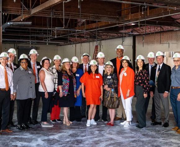 regents wearing hard hats touring the healthcare collaborative buildings